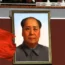 Colour photograph of a portrait of Mao Zedong and the Chinese flag
