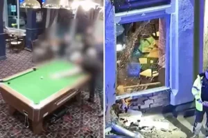 Pool player coolly pots the black despite car ploughing into pub wall inches behind him after 110mph police chase