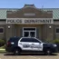 A Senatobia Police car in front of the Senatobia Police Department building