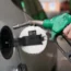 A motorist fills up with petrol