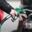 A motorist putting petrol in a car