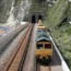 A freight train passes along railway tracks