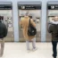 Passengers buying train tickets