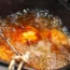 Turkey in boiling oil fryer