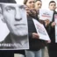 Demonstrators gather outside the home of Russian ambassador Sergei Netshaev in Berlin while contact was lost with Alexei Navalny