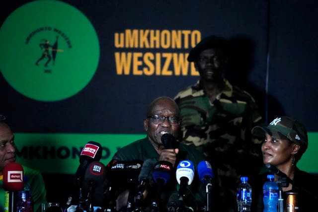 c423ce2844b04ba7a175bf7ddb157cf9 Mr Zuma, centre, speaks as his daughter Duduzile Zuma-Sambudla listens during a press conference where he denounced his former party the ANC