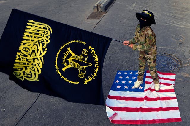 eafb315e1ecd43c7867e9c9a00a4e7b0 A child waves the Palestinian Islamic Jihad group flag as she stands on an American flag during a protest in solidarity with the Palestinian people in Gaza, at Bourj al-Barajneh Palestinian refugee camp, in Beirut, Lebanon, on Sunday