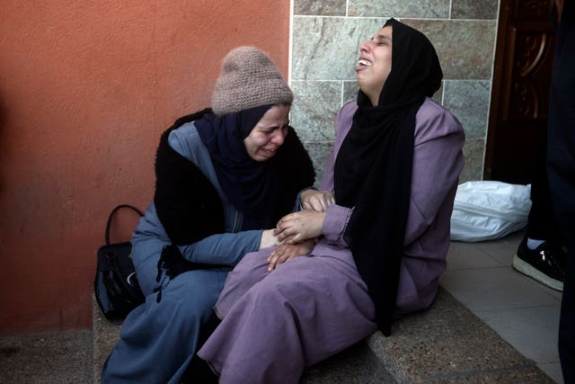 1d7a2ce0de184f7d8b5da1ab9ab5acc0 Palestinians mourn relatives killed in the Israeli bombardment of the Gaza Strip outside a morgue in Khan Younis on Thursday