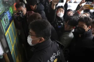 South Korea police raid home of suspect who stabbed opposition leader in neck