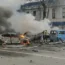 Russian firefighters extinguish burning cars after shelling in Belgorod