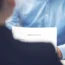 Businesswoman and candidate at office reading CV
