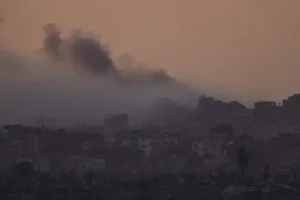 Palestinian militants fight in hard-hit areas of Gaza and fire rockets at Israel