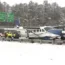 Emergency personnel investigate a small plane on a road in Loudoun County, Virginia