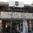 Workers repair the entrance of City Hall, riddled in large bullet holes in Villa Union, Mexico, in 2019 after 22 people were killed in a gun battle between a drug cartel and security forces