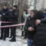 People stand at the site of a Russian attack in Kyiv, Ukraine