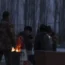 People gathered round a fire