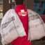 A postman carrying bags of mail