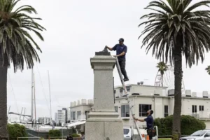 Captain Cook monument cut down by protesters ahead of Australia Day