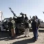 Yemen's Houthi weaponised followers ride vehicles