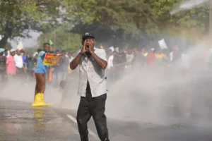 Protesters demonstrating over living costs hit with tear gas and water cannon