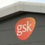 A GSK sign on a production building