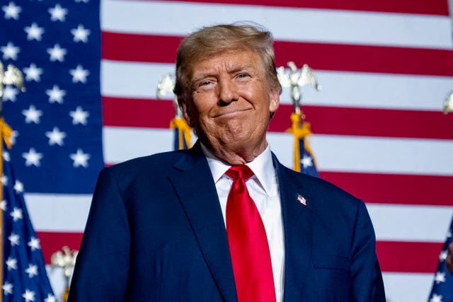 a2f67a4edd704e89874a46b784f69093 Mr Trump appears at a caucus night party in Des Moines, Iowa, on Monday