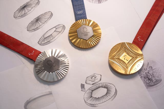 17e8ca28949f4048883619ef94e37abd The Paris 2024 Olympic gold medal, centre, the Paris 2024 Paralympic, gold medal, right, and silver medal, left, are presented to the press in Paris
