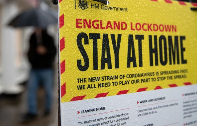 2-74403103 A Government sign warning people to stay at home during the pandemic