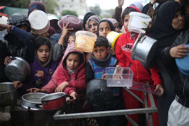 Palestinians line up for free food