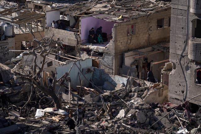 53d56e517c09480b93f87d797d517256 Palestinians look at the destruction after an Israeli strike on residential buildings and a mosque in Rafah, Gaza Strip