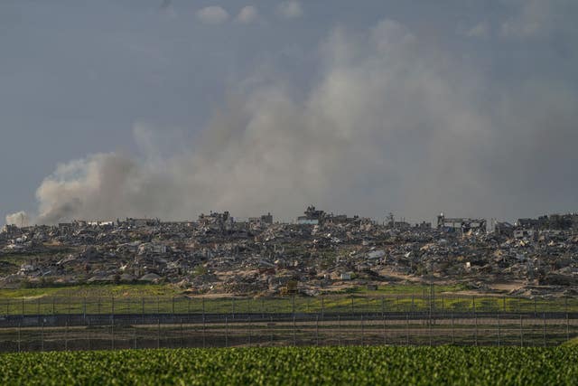 5e4f544236ac4b3282f68470086f5643 Smoke rises behind rubble from buildings destroyed in the Israeli Army’s ground operation in the Gaza Strip as seen from southern Israel, adjacent to the Gaza border fence