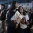 Women listen to a speaker during a weekly rally in Tel Aviv, Israel, calling for the release of hostages who were kidnapped on October 7
