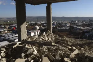Syrians endure winter in muddy tents surrounded by quake damage one year on