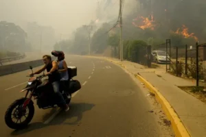 At least 64 dead as forest fires rage in central Chile