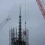 Scaffolding being removed around the spire of Notre Dame de Paris cathedral, showing the rooster and cross (Aurelien Morissard/AP)