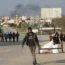 Palestinians carrying their belongings
