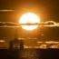 Sun rises behind a redundant oil platform (Jane Barlow/PA)