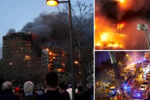 Huge fire rips through two apartment blocks in Valencia leaving residents trapped on their balconies