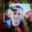 A picture of Alexei Navalny next to flowers in front of the Russian embassy in Berlin
