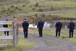 Divers search for bodies of Sydney couple allegedly shot dead by police officer