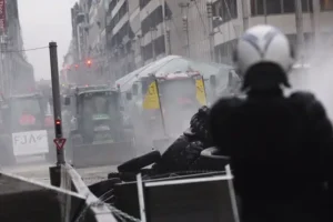 Angry farmers clash with police near EU’s headquarters in fresh show of force
