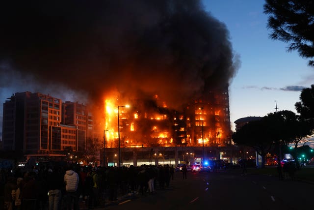 People watch the fire in Valencia from a distance