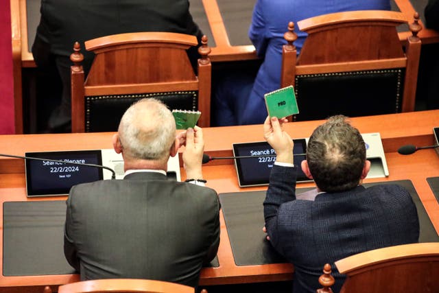 b848deabffbc43b2afb02282e224e9ed Members of the ruling Socialist party vote on the proposal