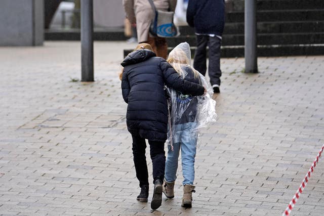 bee0d2e8c8e74b1d8a86099e6d5ca45f Parents pick up their children after the attack