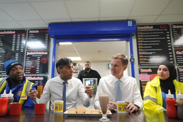 2-75545608 Prime Minister Rishi Sunak and Chancellor of the Exchequer Jeremy Hunt meet staff during a visit to a builders' merchant in south-east London, after the Chancellor delivered his Budget at the Houses of Parliament