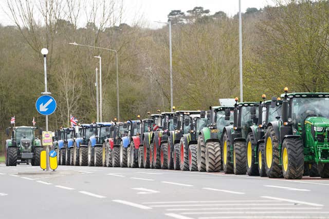 2-75714585 A convoy of farmers in tractors gather on the A20, near Wrotham, in Kent