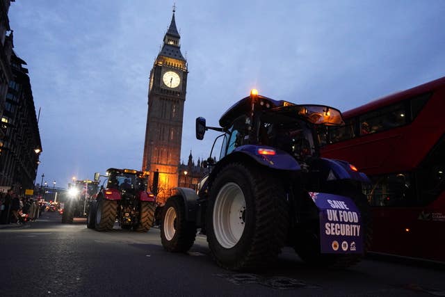 2-75715643 Farmers take part in a tractor 'go-slow' through Parliament Square