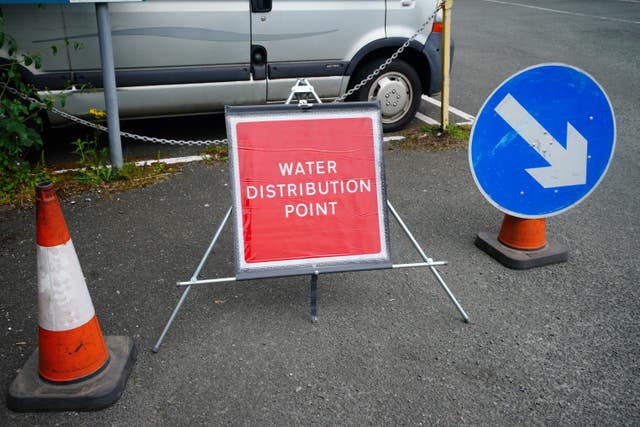2-76202553 A sign advertising water distribution in Brixham, Devon
