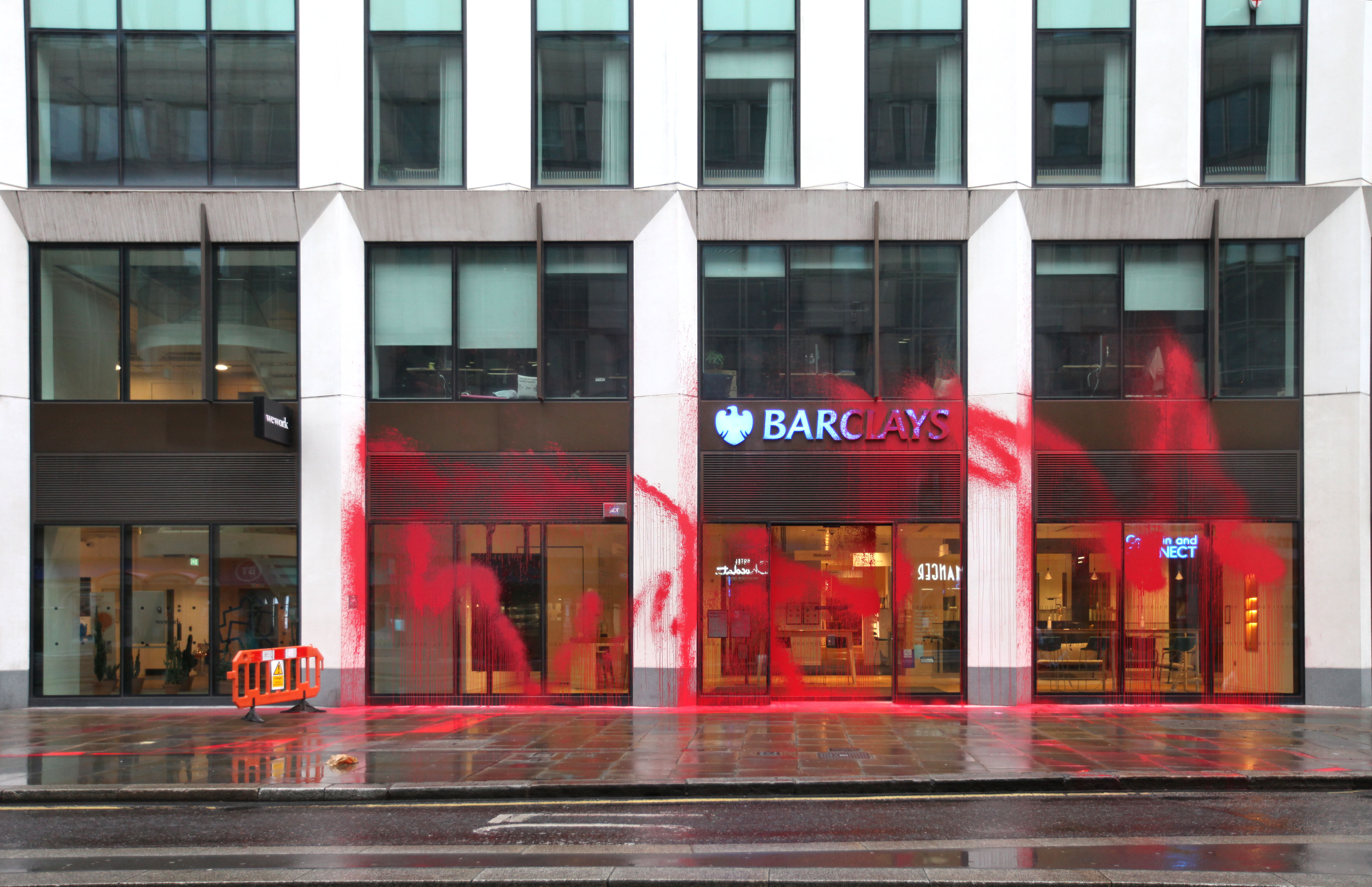 247a896d-d113-4c0e-adab-7484bc59e288 Images sent by Palestine Action show red paint scrawled over the front of a branch in Moorgate, London.