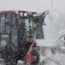 A tractor clears snow